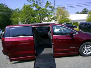 Red Chrysler Voyager with BraunAbility Side Entry Automatic Fold Out conversion
