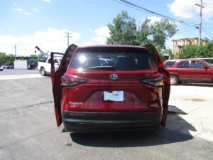 Red Toyota Sienna with BraunAbility Side Entry Automatic In Floor conversion