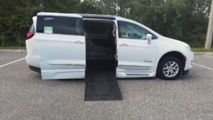 White Chrysler Pacifica with BraunAbility Side Entry Automatic Fold Out conversion