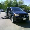 Black Dodge Grand Caravan with BraunAbility Side Entry Automatic Fold Out conversion