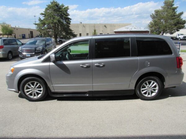 Silver Dodge Grand Caravan with Driverge Side Entry Automatic Fold Out conversion