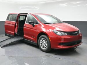Red Chrysler Voyager with BraunAbility Side Entry Manual Fold Out conversion