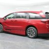 Red Honda Odyssey with BraunAbility Side Entry Automatic In Floor conversion