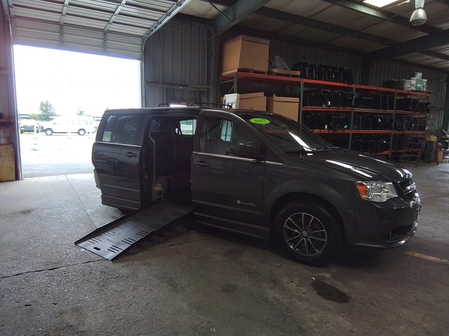 Grey Dodge Grand Caravan with BraunAbility Side Entry Automatic Fold Out conversion