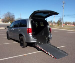 Silver Dodge Grand Caravan with Driverge Rear Entry Manual Fold Out conversion