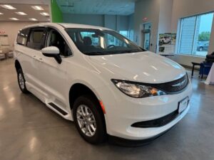 White Chrysler Voyager with BraunAbility Side Entry Automatic Fold Out conversion