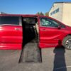 Red Honda Odyssey with BraunAbility Side Entry Automatic In Floor conversion