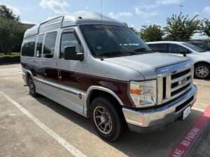 Silver Ford Econoline with Other Side Entry Automatic Fold Out conversion