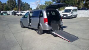 Silver Dodge Grand Caravan with Driverge Rear Entry Manual Fold Out conversion