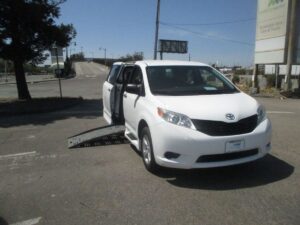 White Toyota Sienna with BraunAbility Side Entry Manual Fold Out conversion