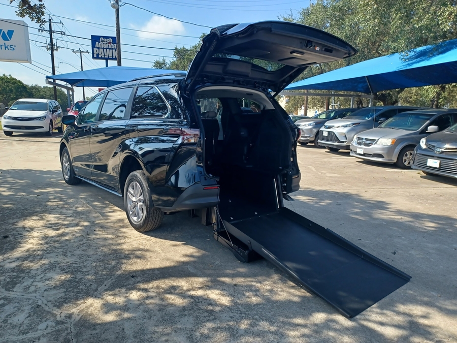 Black Toyota Sienna with Driverge Rear Entry Manual Fold Out conversion