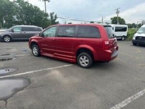 Red Dodge Grand Caravan with BraunAbility Side Entry Automatic Fold Out conversion
