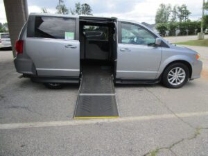 Silver Dodge Grand Caravan with Driverge Side Entry Automatic Fold Out conversion
