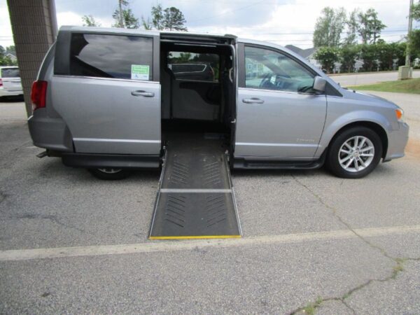 Silver Dodge Grand Caravan with Driverge Side Entry Automatic Fold Out conversion
