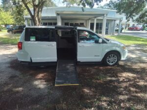 White Dodge Grand Caravan with Driverge Side Entry Automatic Fold Out conversion