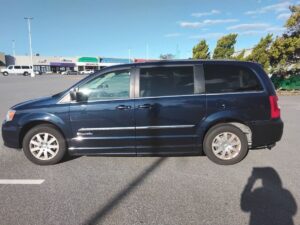 Blue Chrysler Town and Country with BraunAbility Side Entry Automatic Fold Out conversion