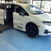 White Honda Odyssey with BraunAbility Side Entry Automatic In Floor conversion
