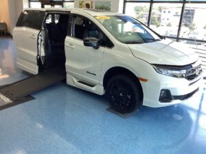 White Honda Odyssey with BraunAbility Side Entry Automatic In Floor conversion