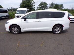 White Chrysler Voyager with Driverge Side Entry Automatic Fold Out conversion
