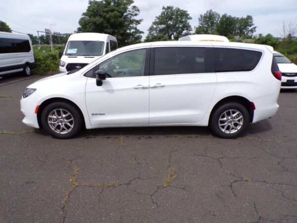 White Chrysler Voyager with Driverge Side Entry Automatic Fold Out conversion