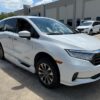 White Honda Odyssey with BraunAbility Side Entry Automatic In Floor conversion