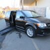 Black Dodge Grand Caravan with BraunAbility Side Entry Automatic Fold Out conversion