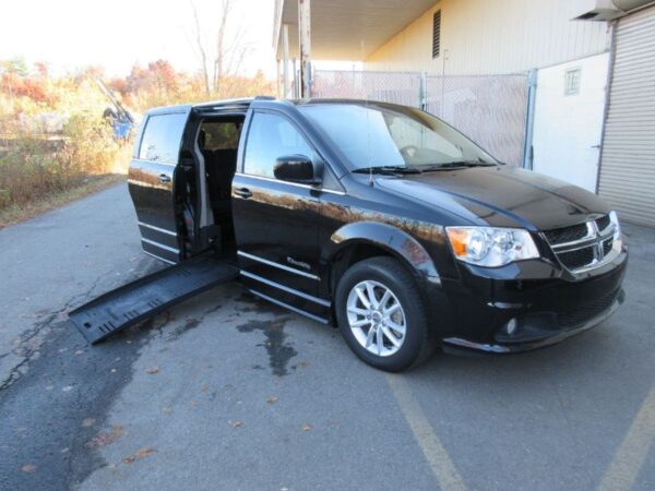 Black Dodge Grand Caravan with BraunAbility Side Entry Automatic Fold Out conversion