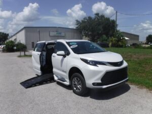 White Toyota Sienna with BraunAbility Side Entry Automatic Fold Out conversion