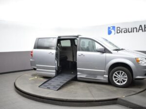 Silver Dodge Grand Caravan with BraunAbility Side Entry Automatic Fold Out conversion