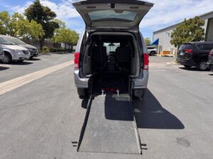 Silver Dodge Grand Caravan with Driverge Rear Entry Manual Fold Out conversion