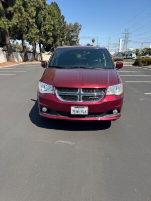 Red Dodge Grand Caravan with BraunAbility Side Entry Automatic Fold Out conversion