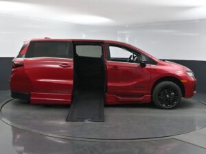 Red Honda Odyssey with BraunAbility Side Entry Automatic In Floor conversion
