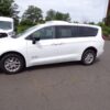 White Chrysler Voyager with Driverge Rear Entry Manual Fold Out conversion