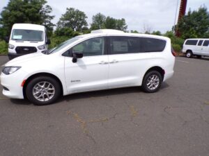 White Chrysler Voyager with Driverge Rear Entry Manual Fold Out conversion