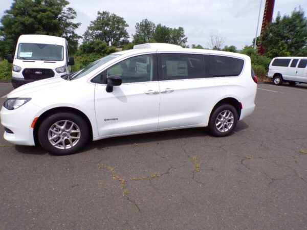White Chrysler Voyager with Driverge Rear Entry Manual Fold Out conversion