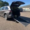 Grey Toyota Sienna with Driverge Rear Entry Manual Fold Out conversion