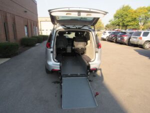 Silver Chrysler Pacifica with Driverge Rear Entry Manual Fold Out conversion