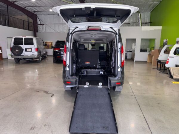 White Ford Transit Connect with Driverge Rear Entry Manual Fold Out conversion