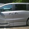 Silver Honda Odyssey with BraunAbility Side Entry Automatic In Floor conversion