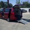 Red Chrysler Voyager with Driverge Rear Entry Manual Fold Out conversion