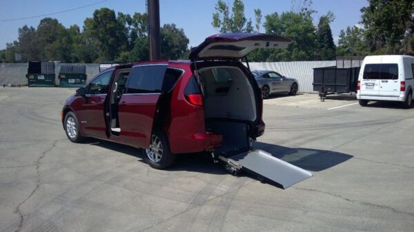 Red Chrysler Voyager with Driverge Rear Entry Manual Fold Out conversion