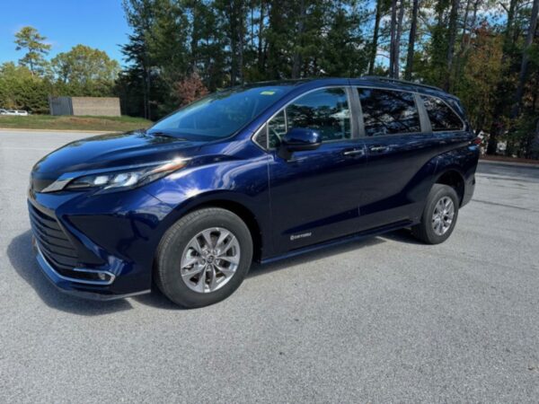 Blue Toyota Sienna with Driverge Rear Entry Manual Fold Out conversion
