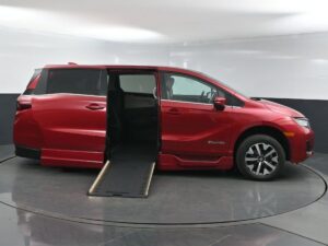 Red Honda Odyssey with BraunAbility Side Entry Automatic In Floor conversion