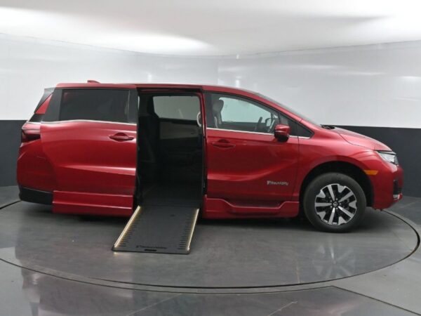 Red Honda Odyssey with BraunAbility Side Entry Automatic In Floor conversion