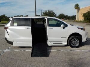 White Toyota Sienna with BraunAbility Side Entry Automatic Fold Out conversion