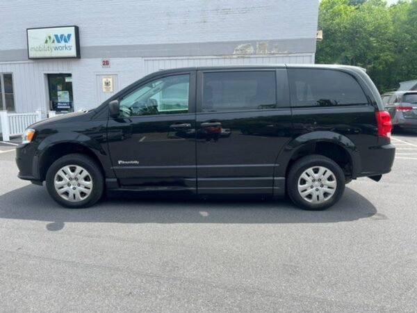 Black Dodge Grand Caravan with BraunAbility Side Entry Automatic Fold Out conversion