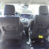 White Chrysler Pacifica with Driverge Side Entry Automatic Fold Out conversion