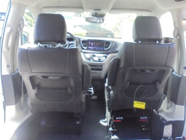 White Chrysler Pacifica with Driverge Side Entry Automatic Fold Out conversion