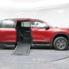 Red Chevrolet Traverse with BraunAbility Side Entry Automatic In Floor conversion