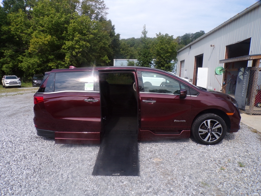Red Honda Odyssey with BraunAbility Side Entry Automatic In Floor conversion